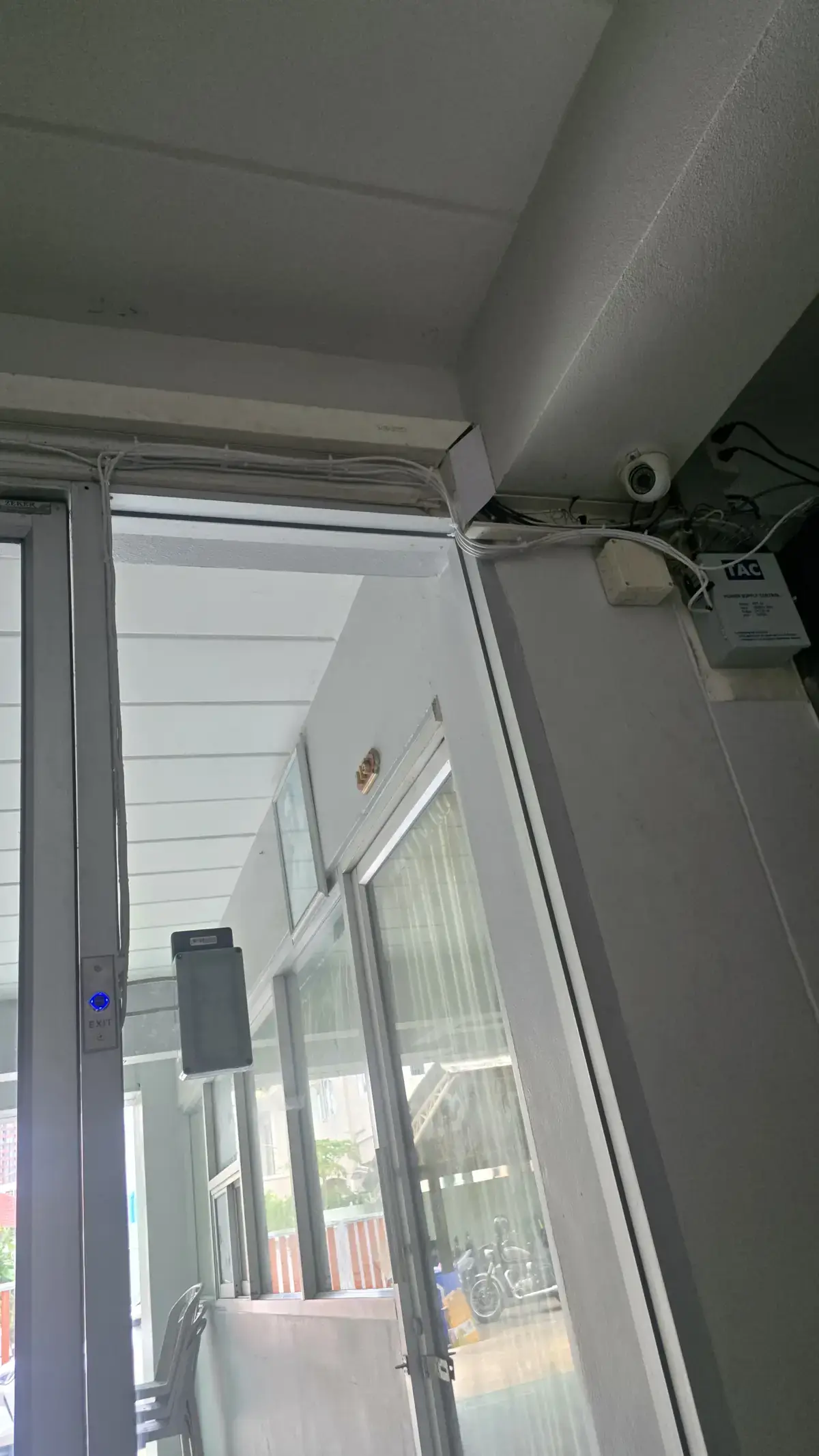 Cable run above the door frame and the power supply box